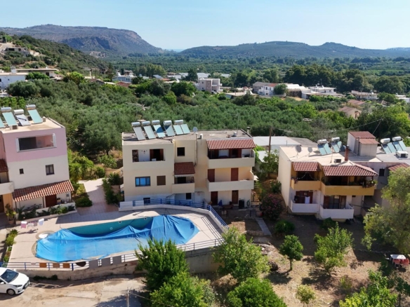 Two-bedroom first floor apartment with a large shared pool & White Mountains view in Stylos
