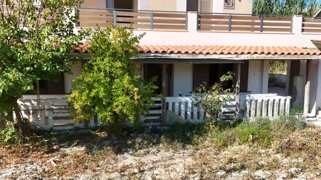 Two-bedroom ground floor apartment with a spacious plot & within walking distance to the beach in Kalyves