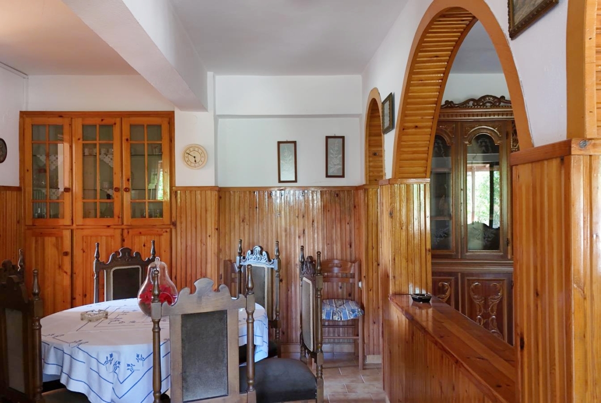 Two-bedroom ground floor apartment with a spacious plot & within walking distance to the beach in Kalyves
