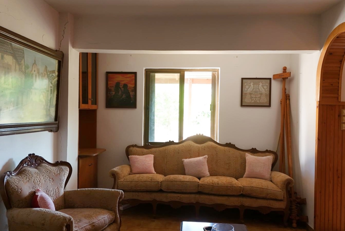 Two-bedroom ground floor apartment with a spacious plot & within walking distance to the beach in Kalyves