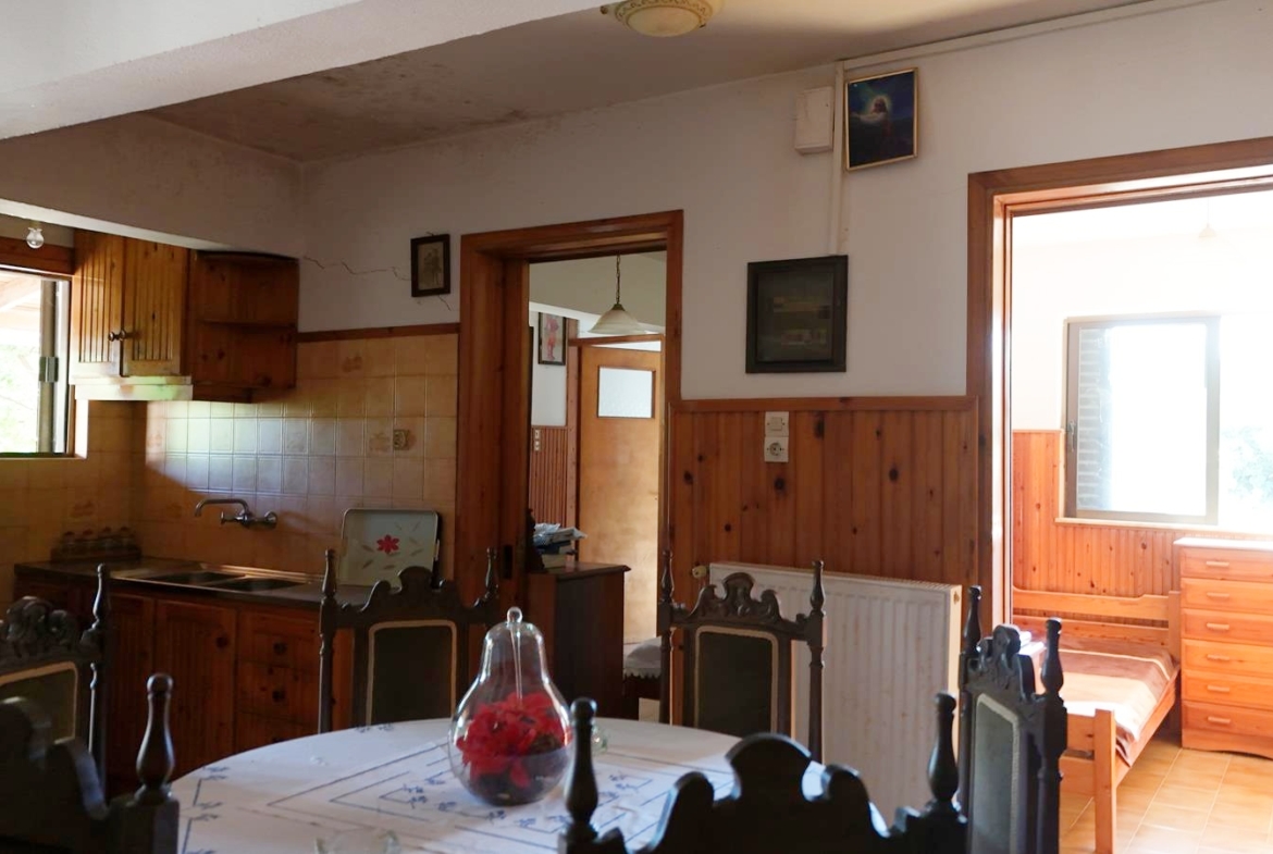 Two-bedroom ground floor apartment with a spacious plot & within walking distance to the beach in Kalyves