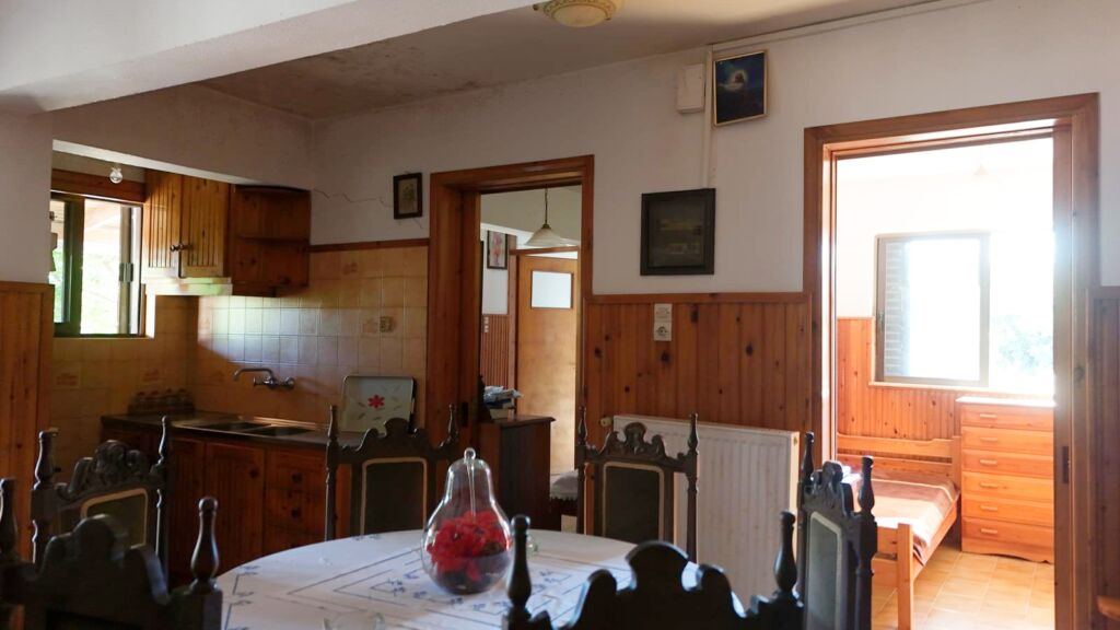 Two-bedroom ground floor apartment with a spacious plot & within walking distance to the beach in Kalyves