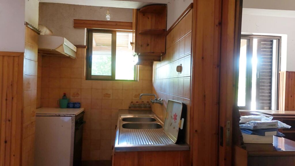 Two-bedroom ground floor apartment with a spacious plot & within walking distance to the beach in Kalyves