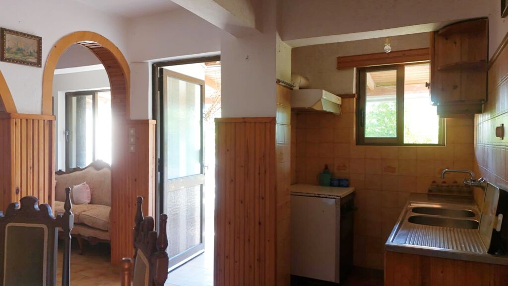 Two-bedroom ground floor apartment with a spacious plot & within walking distance to the beach in Kalyves