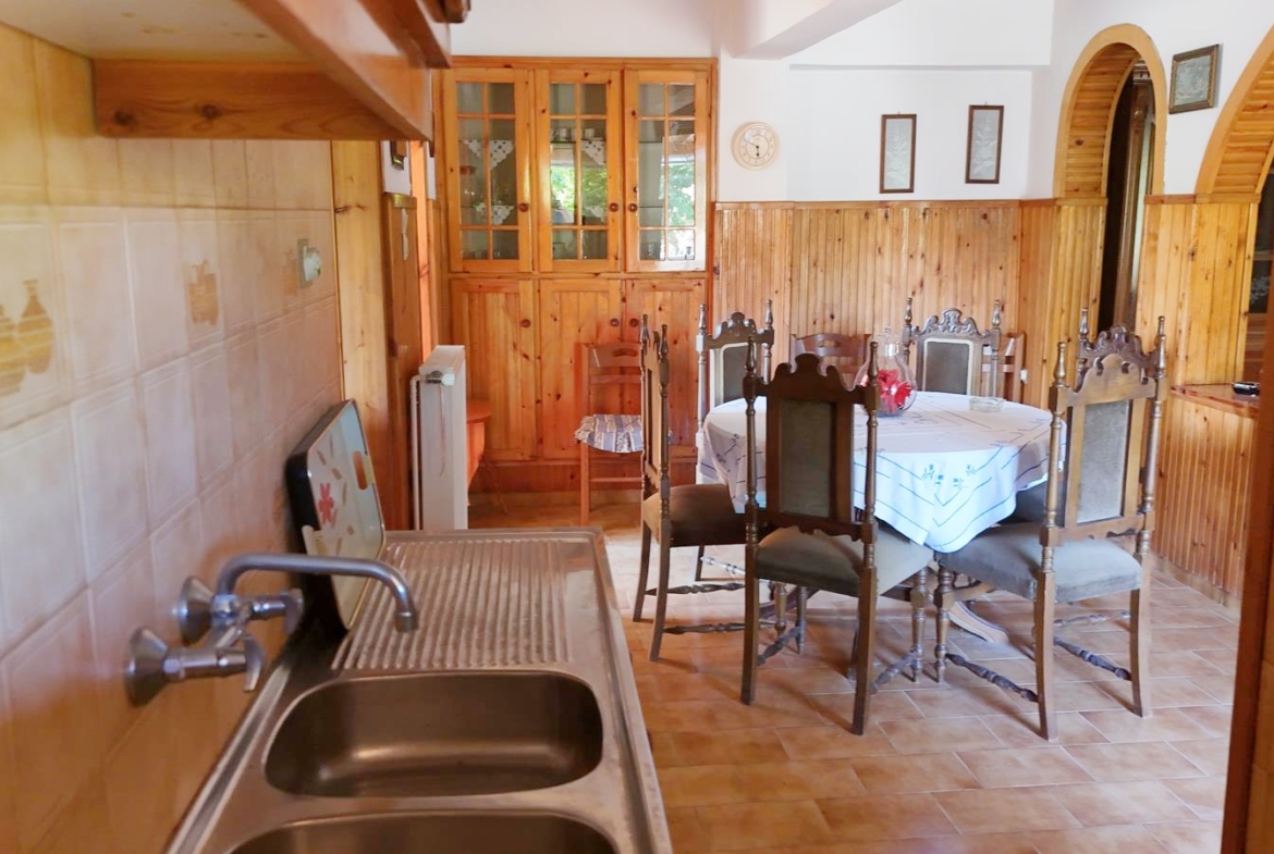 Two-bedroom ground floor apartment with a spacious plot & within walking distance to the beach in Kalyves