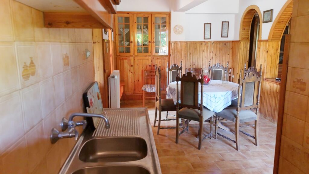 Two-bedroom ground floor apartment with a spacious plot & within walking distance to the beach in Kalyves