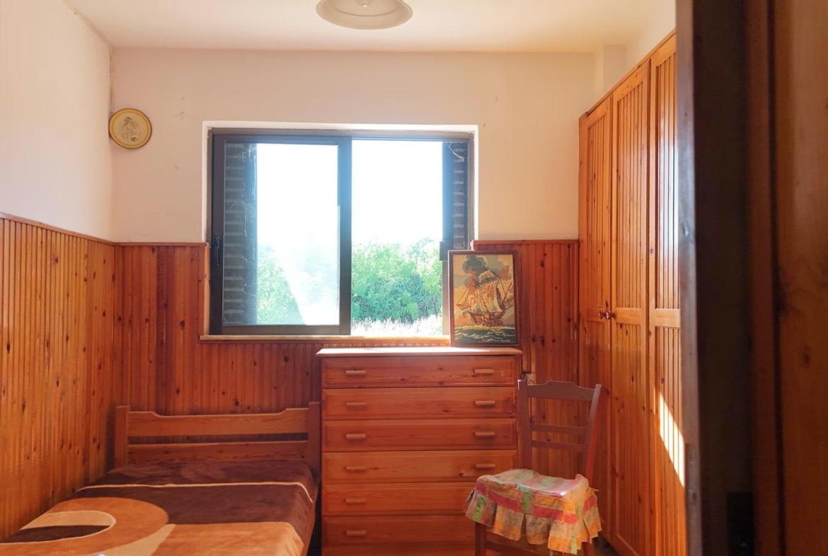 Two-bedroom ground floor apartment with a spacious plot & within walking distance to the beach in Kalyves