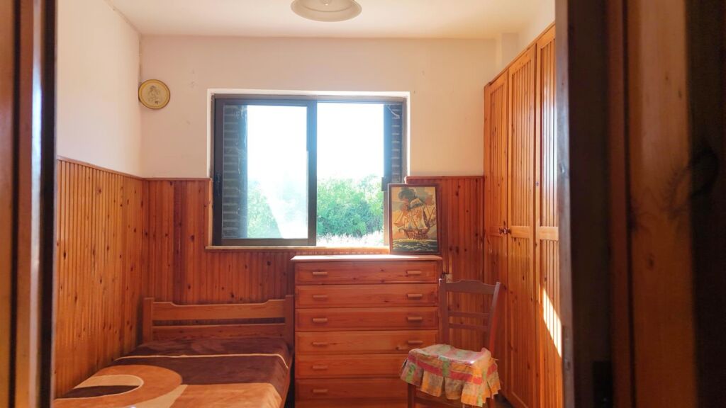 Two-bedroom ground floor apartment with a spacious plot & within walking distance to the beach in Kalyves