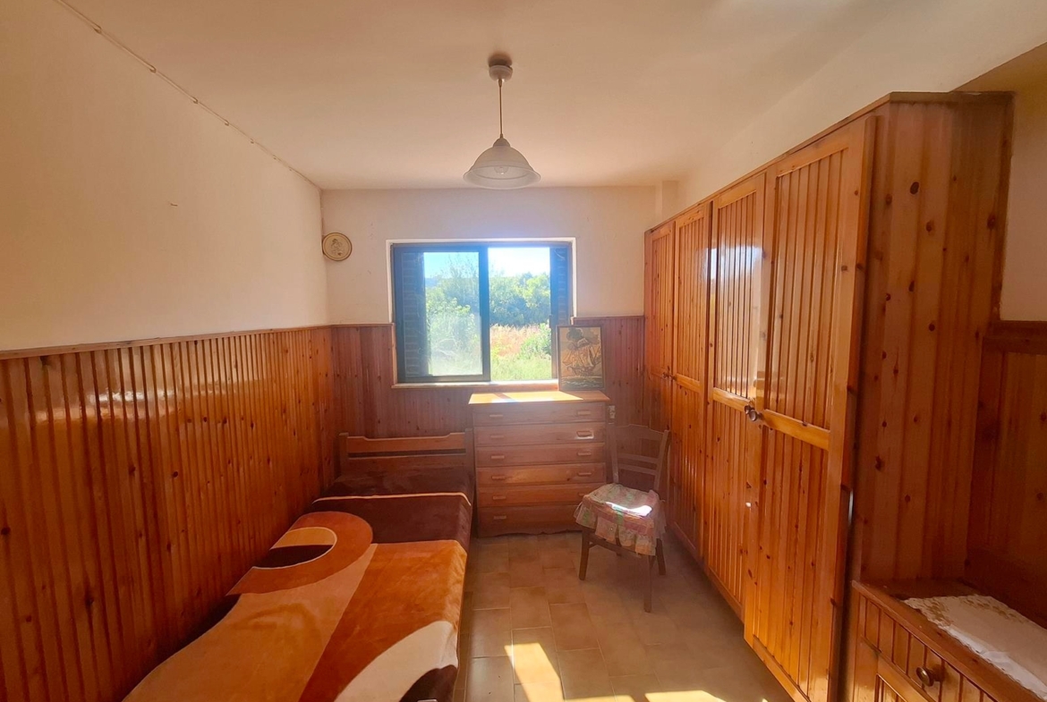 Two-bedroom ground floor apartment with a spacious plot & within walking distance to the beach in Kalyves