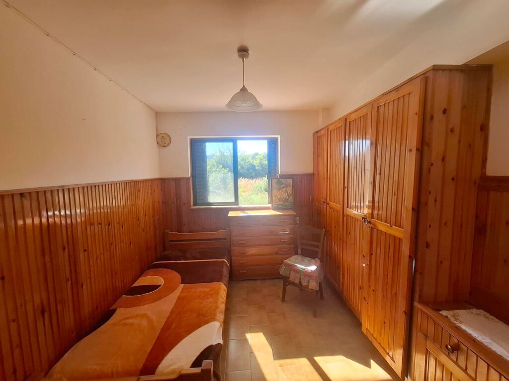 Two-bedroom ground floor apartment with a spacious plot & within walking distance to the beach in Kalyves