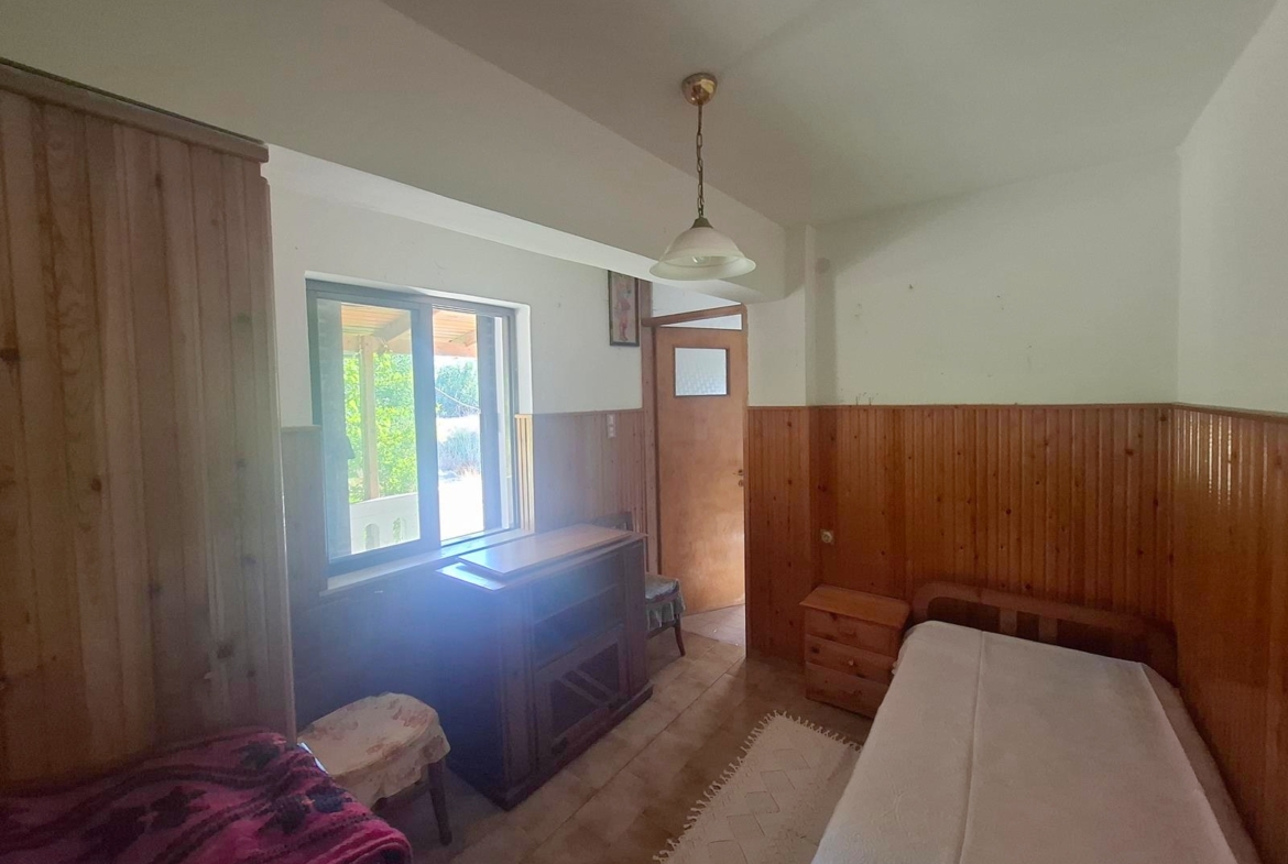 Two-bedroom ground floor apartment with a spacious plot & within walking distance to the beach in Kalyves