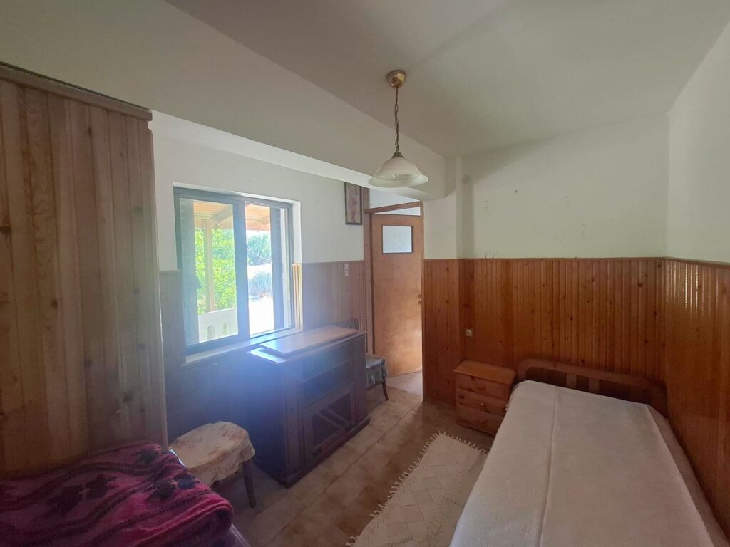 Two-bedroom ground floor apartment with a spacious plot & within walking distance to the beach in Kalyves