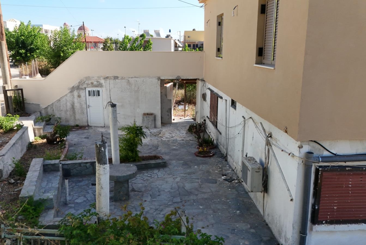 Two-bedroom ground floor apartment with a spacious plot & within walking distance to the beach in Kalyves