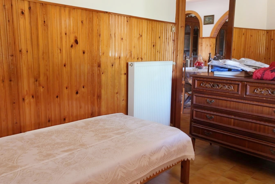 Two-bedroom ground floor apartment with a spacious plot & within walking distance to the beach in Kalyves