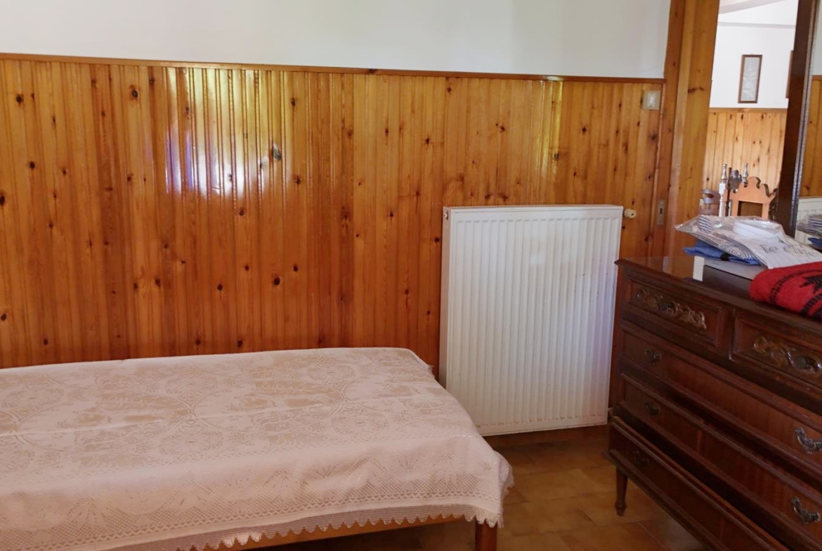 Two-bedroom ground floor apartment with a spacious plot & within walking distance to the beach in Kalyves