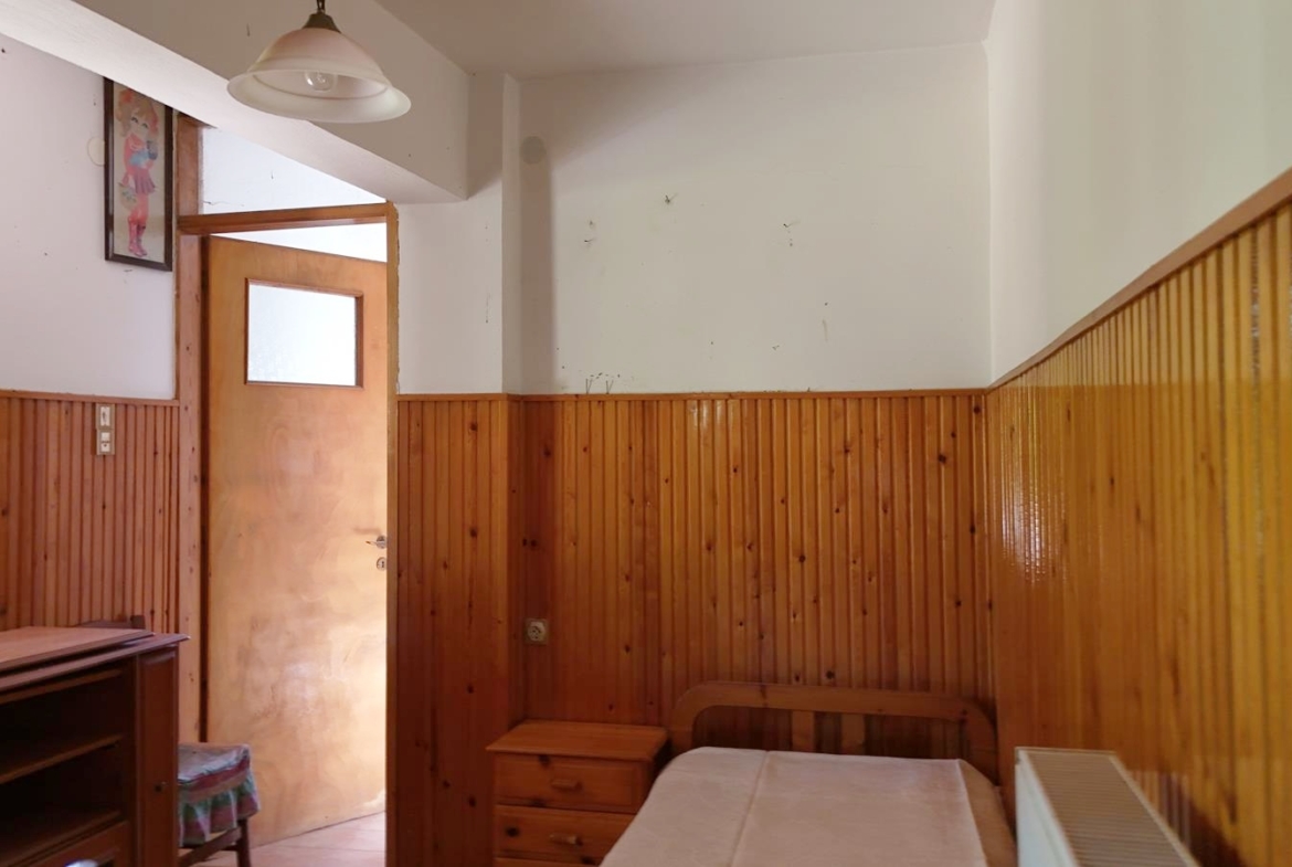 Two-bedroom ground floor apartment with a spacious plot & within walking distance to the beach in Kalyves