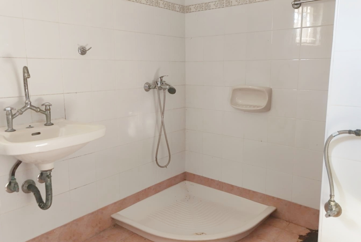 Two-bedroom ground floor apartment with a spacious plot & within walking distance to the beach in Kalyves