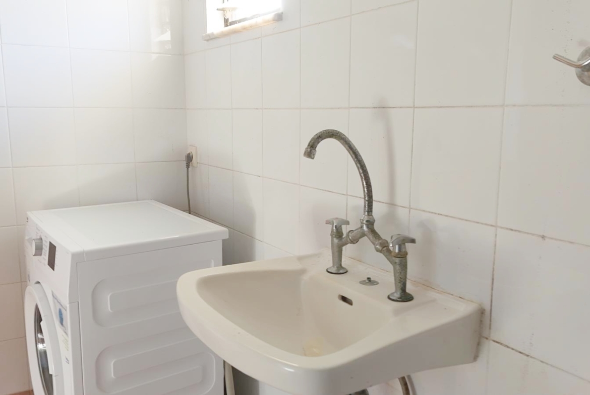Two-bedroom ground floor apartment with a spacious plot & within walking distance to the beach in Kalyves