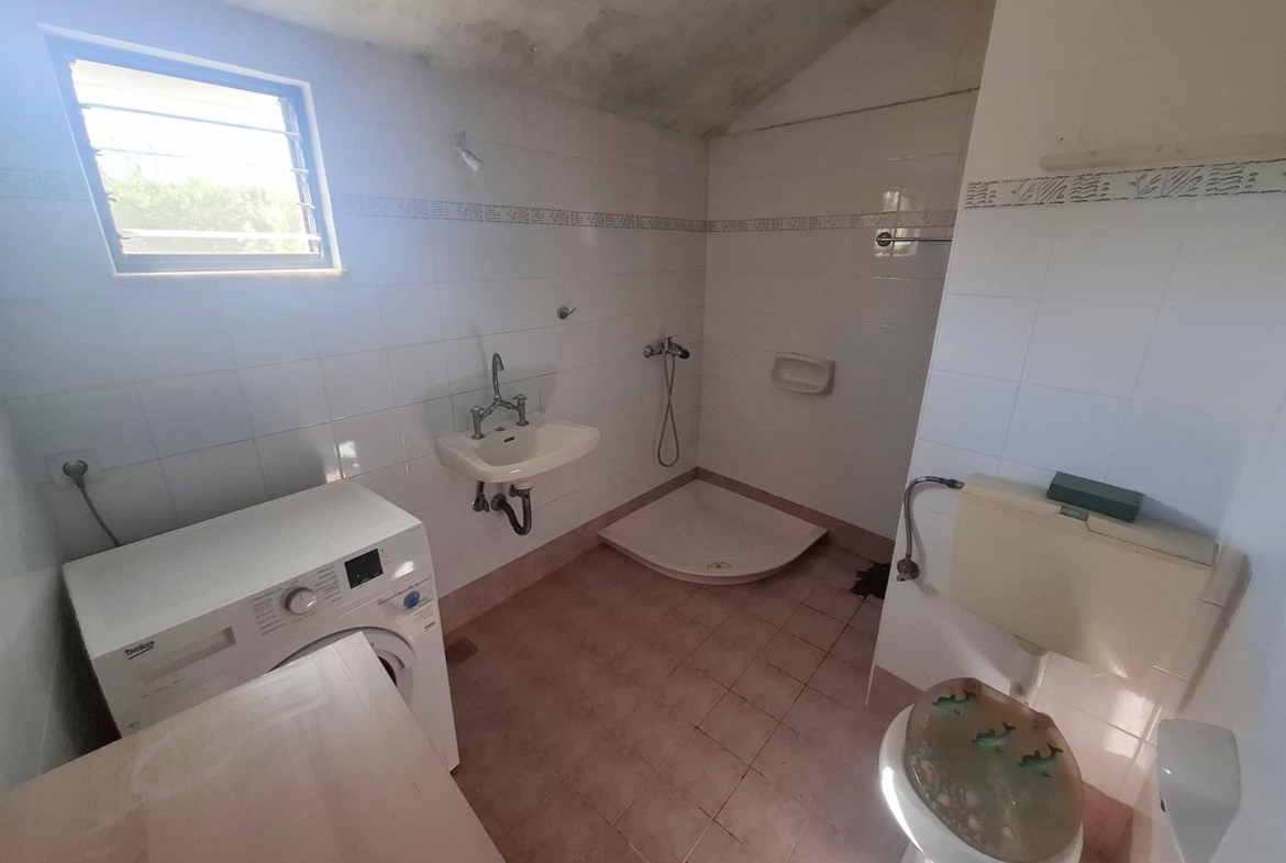 Two-bedroom ground floor apartment with a spacious plot & within walking distance to the beach in Kalyves