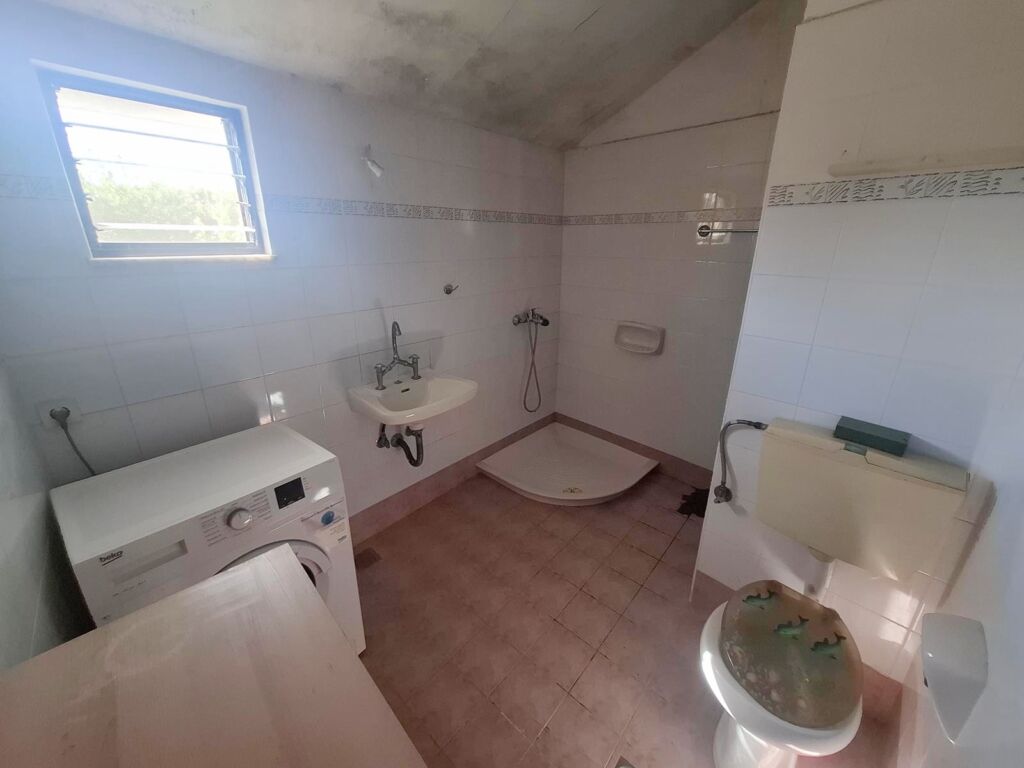 Two-bedroom ground floor apartment with a spacious plot & within walking distance to the beach in Kalyves