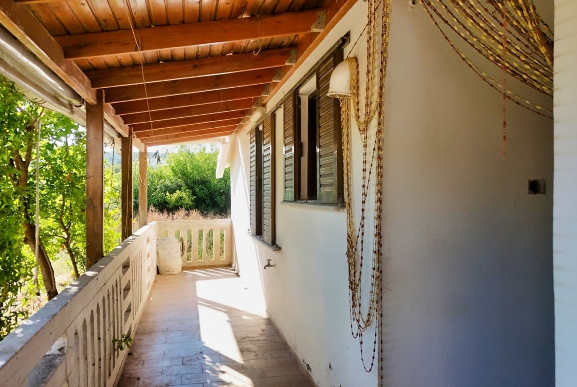 Two-bedroom ground floor apartment with a spacious plot & within walking distance to the beach in Kalyves