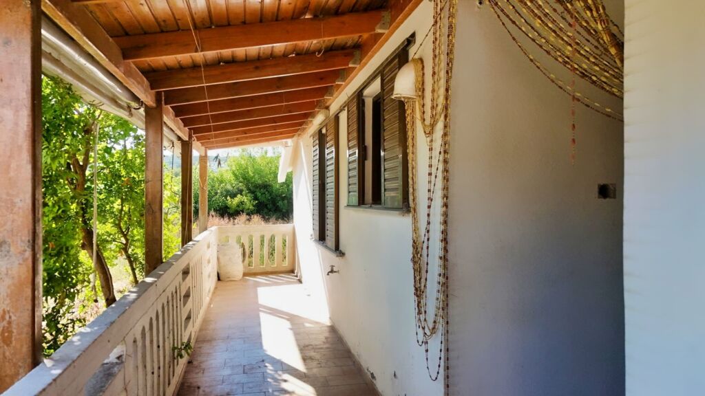 Two-bedroom ground floor apartment with a spacious plot & within walking distance to the beach in Kalyves