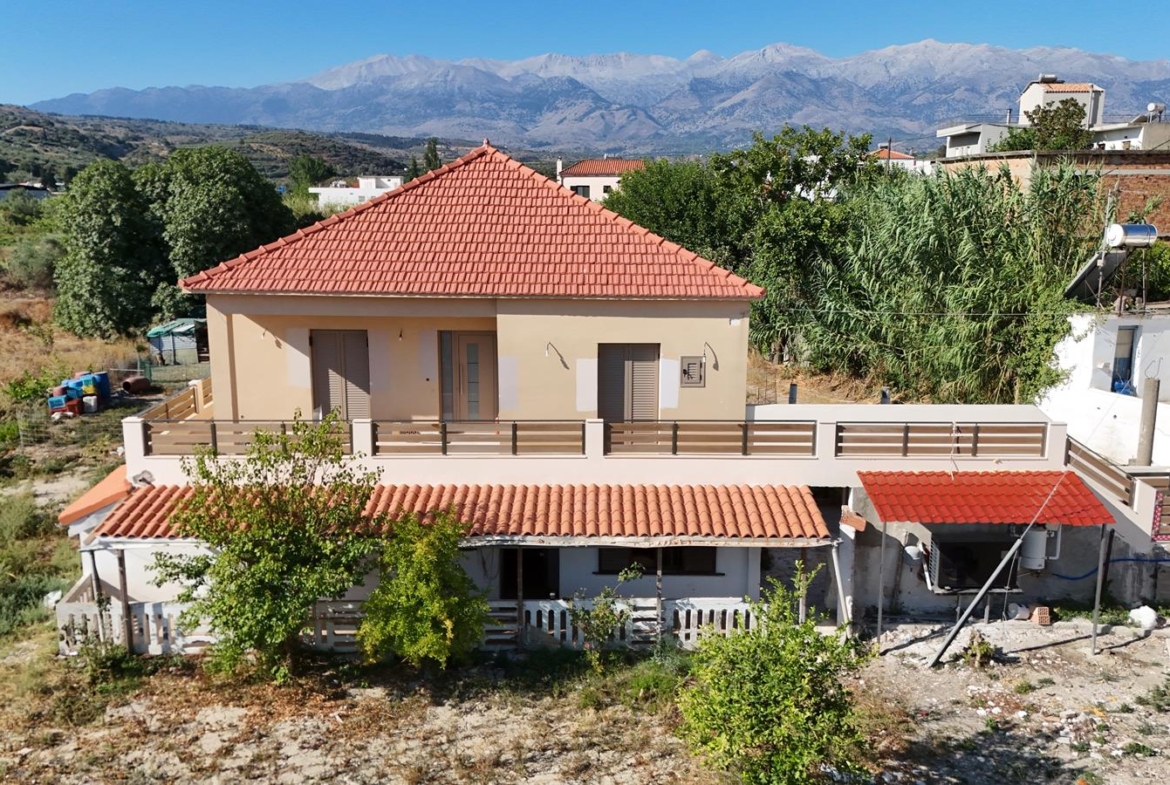 Two-bedroom ground floor apartment with a spacious plot & within walking distance to the beach in Kalyves