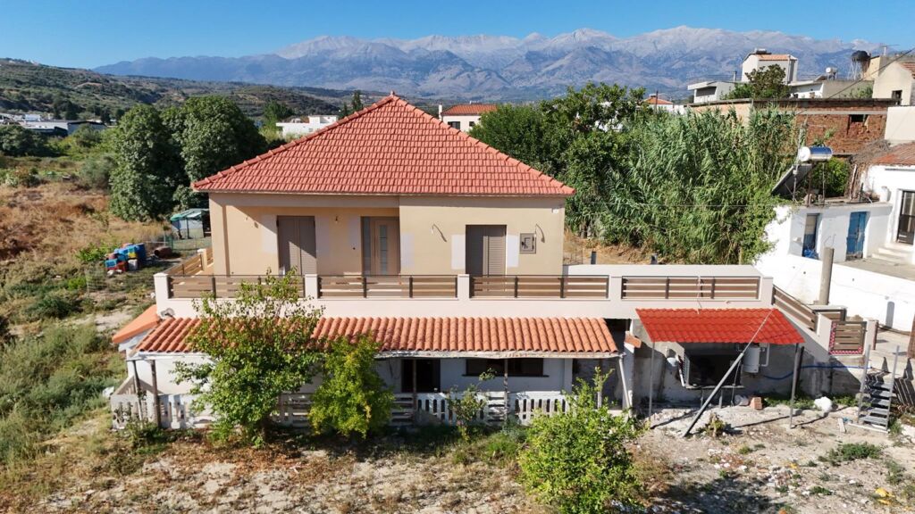Two-bedroom ground floor apartment with a spacious plot & within walking distance to the beach in Kalyves