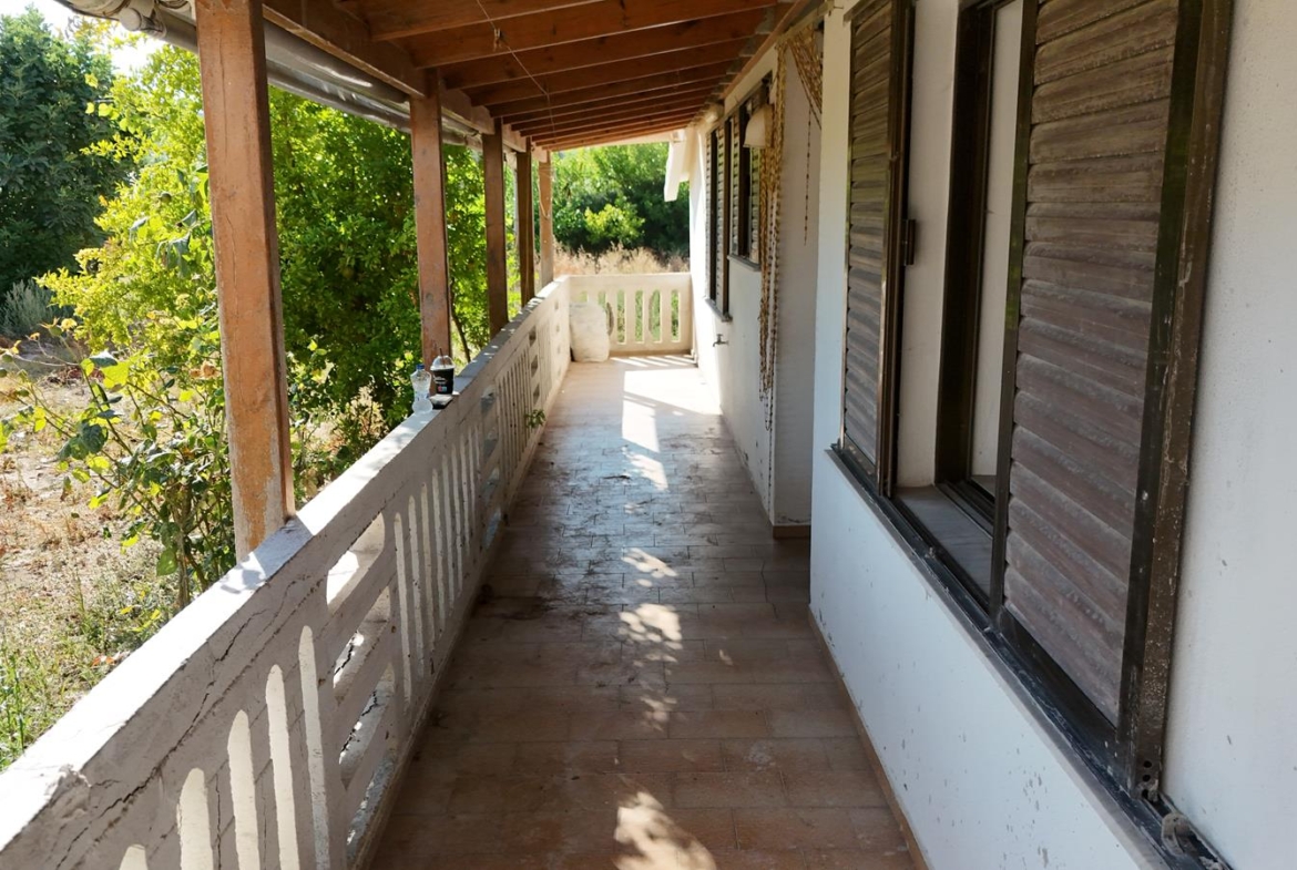 Two-bedroom ground floor apartment with a spacious plot & within walking distance to the beach in Kalyves