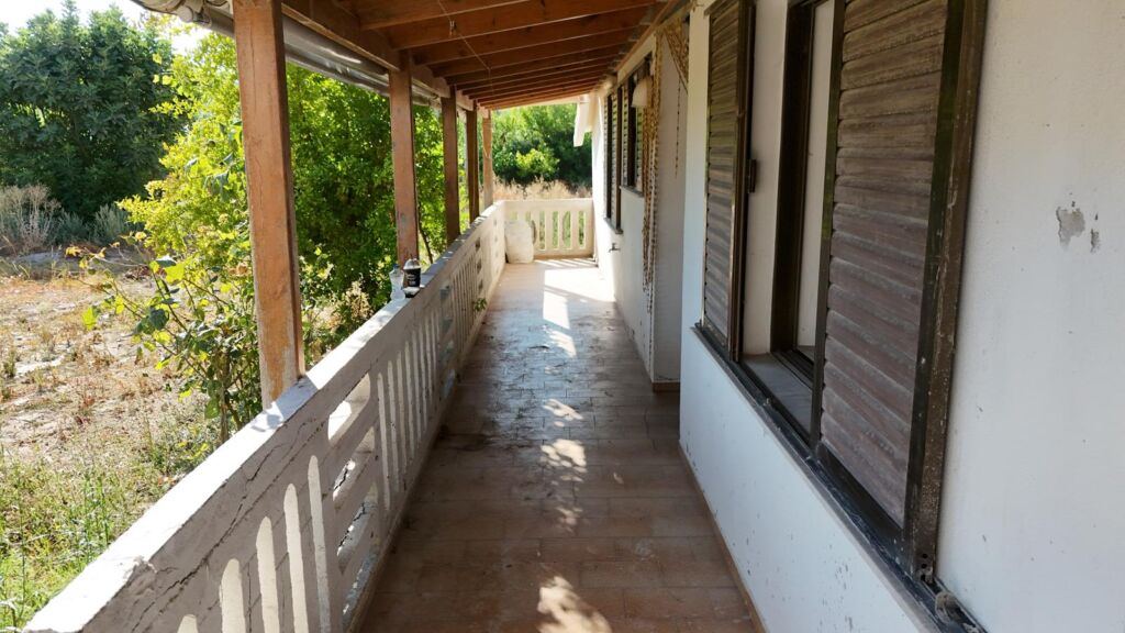 Two-bedroom ground floor apartment with a spacious plot & within walking distance to the beach in Kalyves