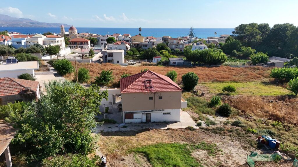 Two-bedroom ground floor apartment with a spacious plot & within walking distance to the beach in Kalyves