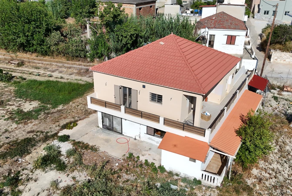 Two-bedroom ground floor apartment with a spacious plot & within walking distance to the beach in Kalyves