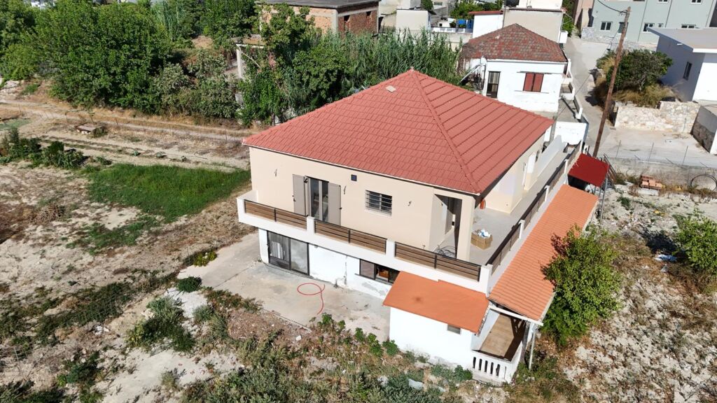Two-bedroom ground floor apartment with a spacious plot & within walking distance to the beach in Kalyves