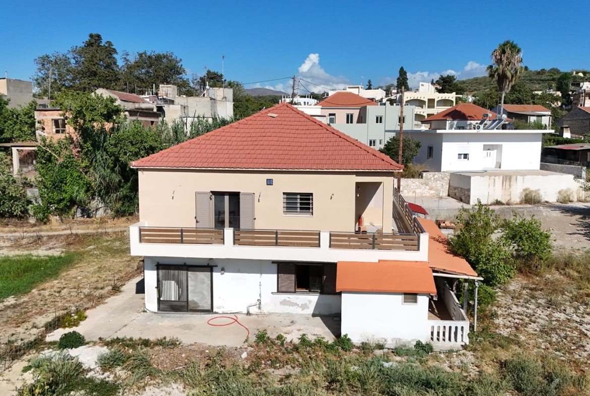 Two-bedroom ground floor apartment with a spacious plot & within walking distance to the beach in Kalyves