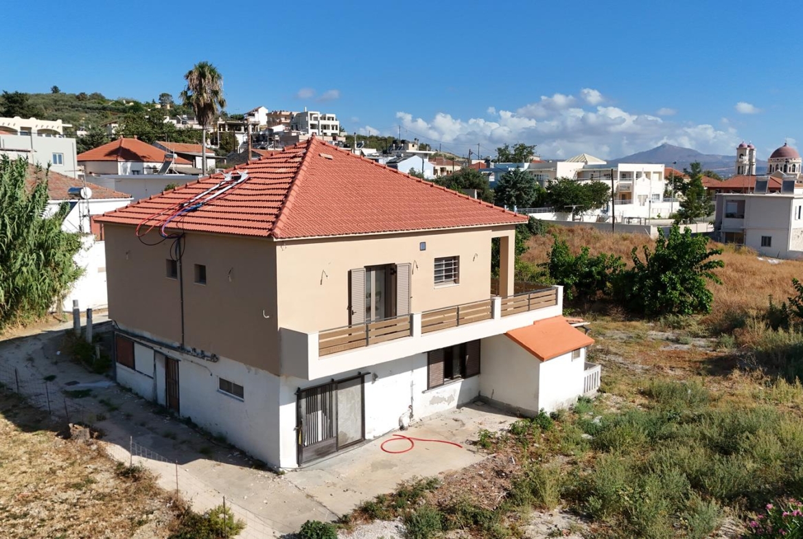 Two-bedroom ground floor apartment with a spacious plot & within walking distance to the beach in Kalyves