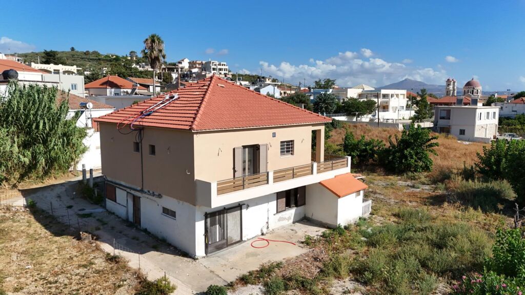 Two-bedroom ground floor apartment with a spacious plot & within walking distance to the beach in Kalyves