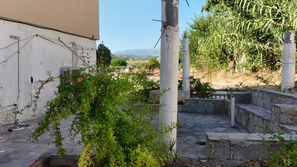 Two-bedroom ground floor apartment with a spacious plot & within walking distance to the beach in Kalyves