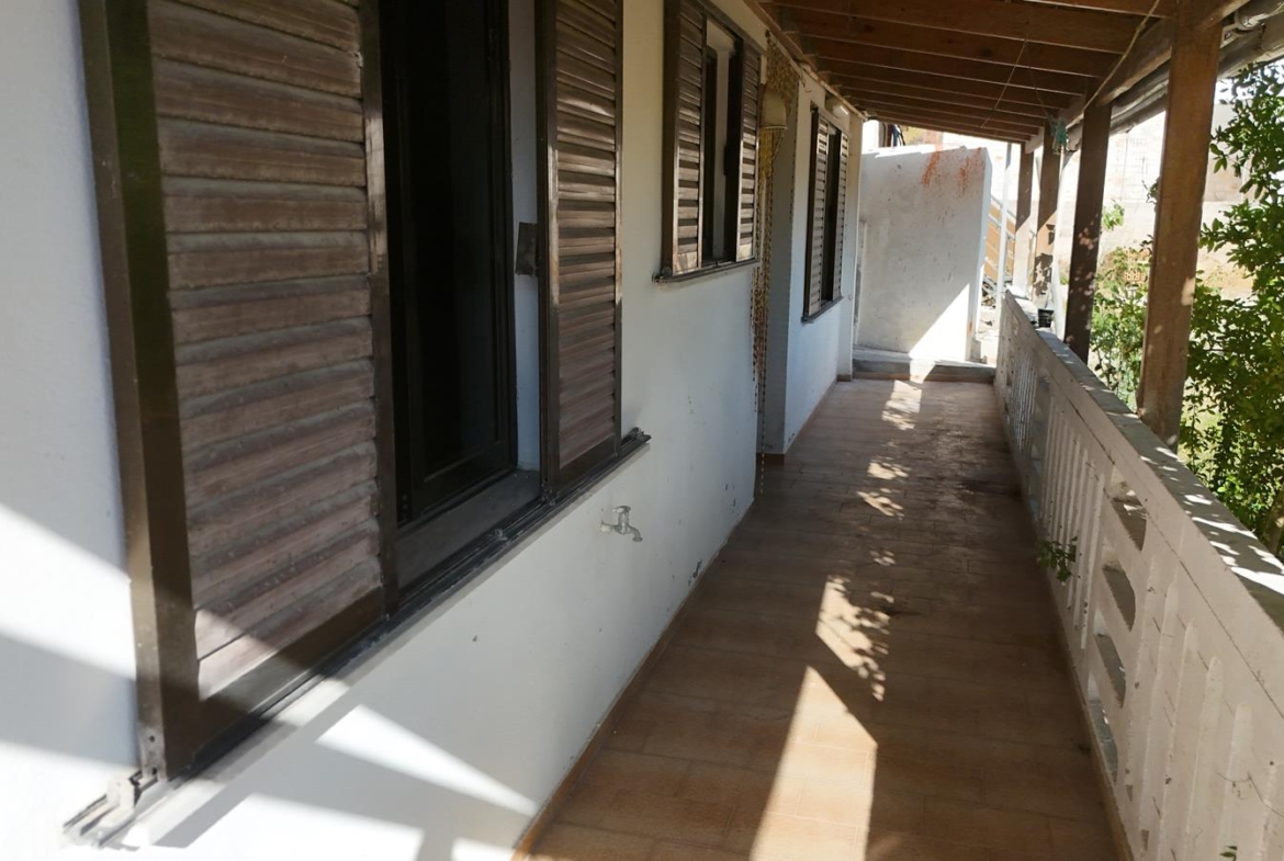 Two-bedroom ground floor apartment with a spacious plot & within walking distance to the beach in Kalyves