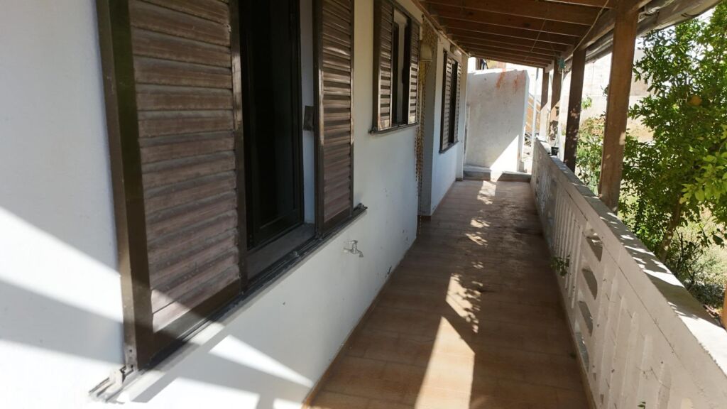 Two-bedroom ground floor apartment with a spacious plot & within walking distance to the beach in Kalyves