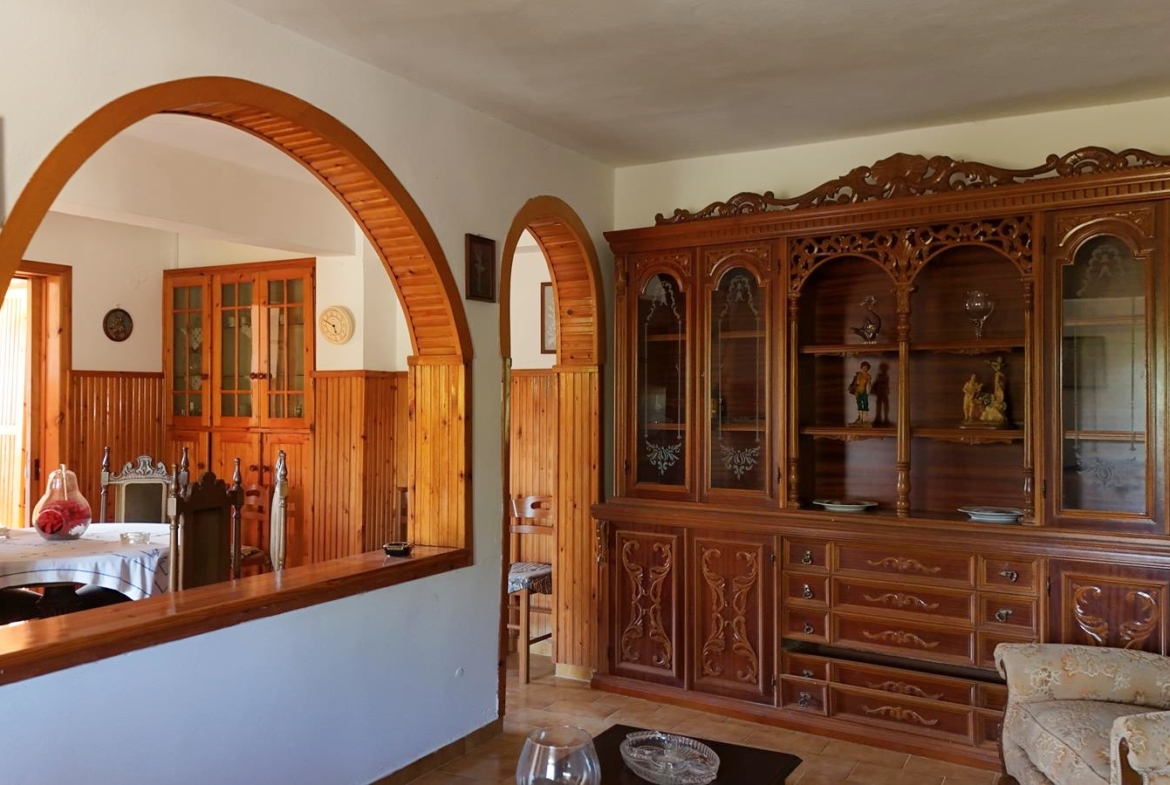 Two-bedroom ground floor apartment with a spacious plot & within walking distance to the beach in Kalyves