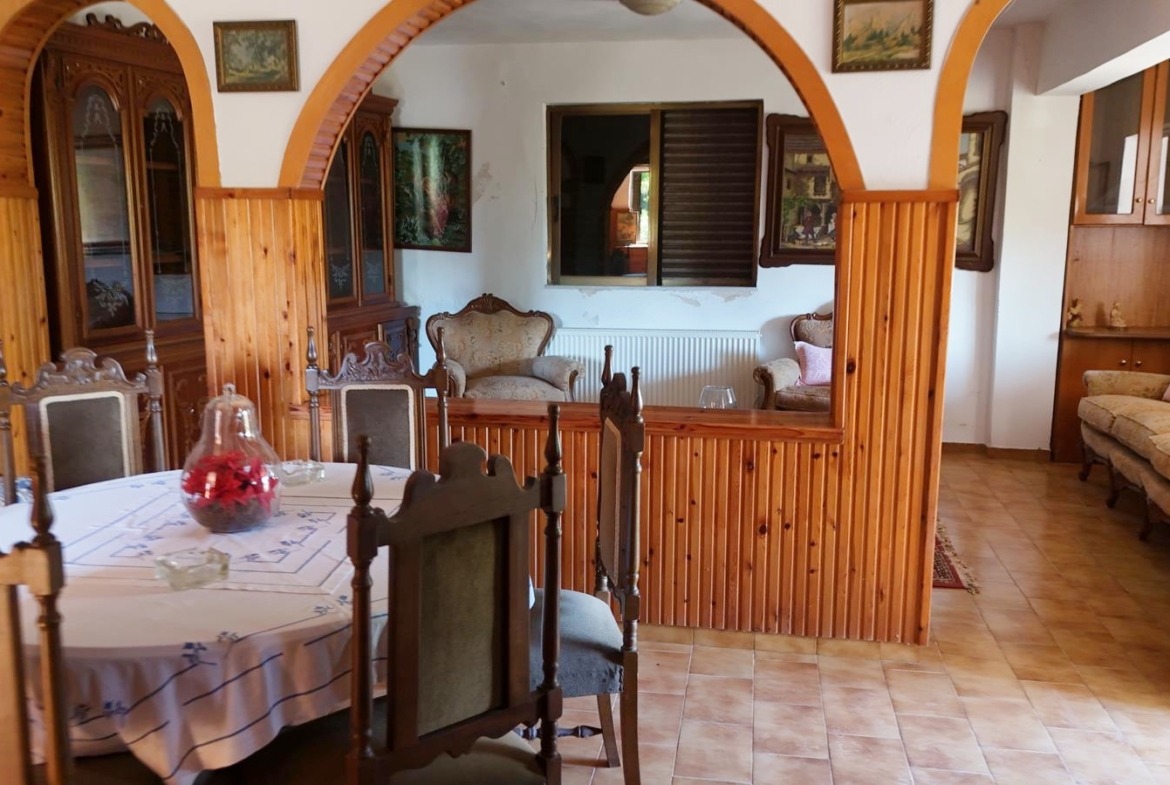 Two-bedroom ground floor apartment with a spacious plot & within walking distance to the beach in Kalyves