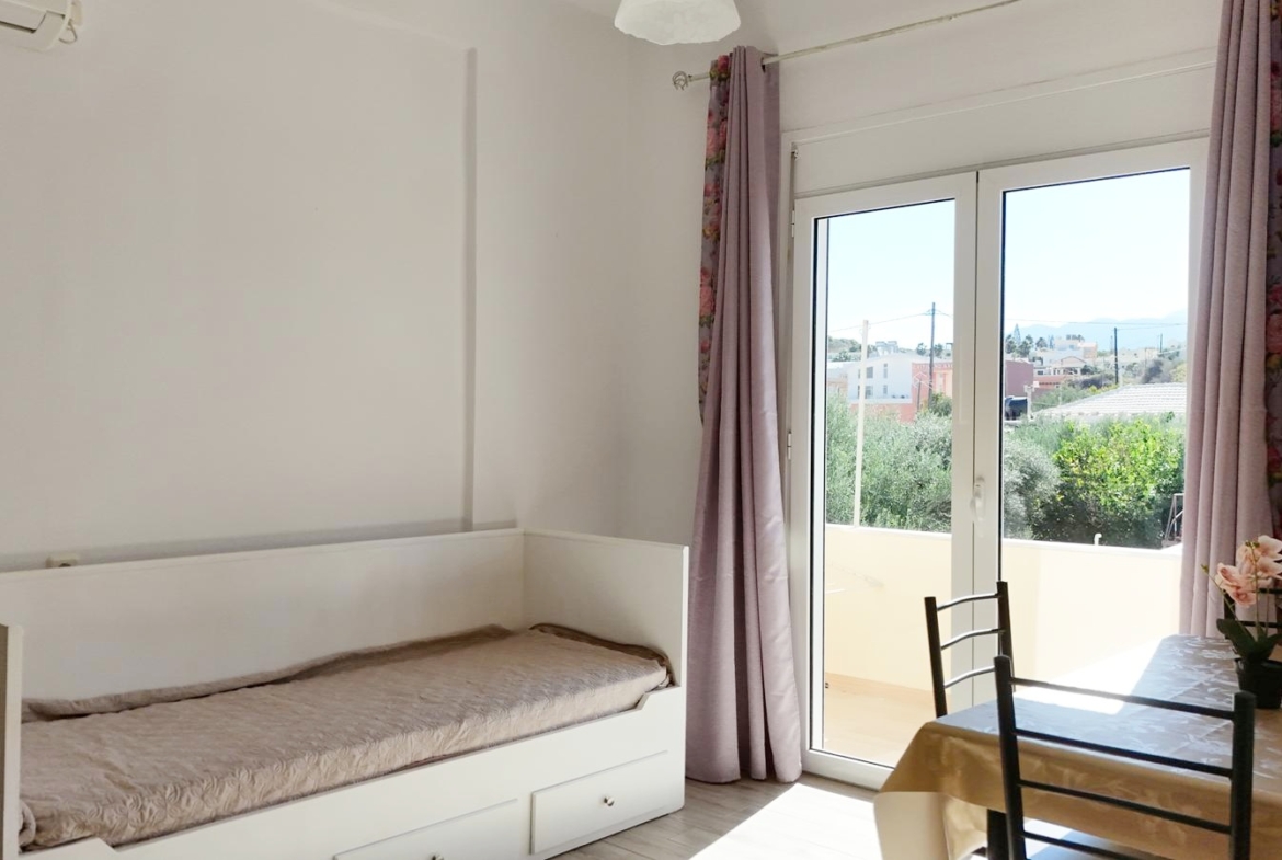 Beachfront one-bedroom apartment with White Mountains view in Almyrida
