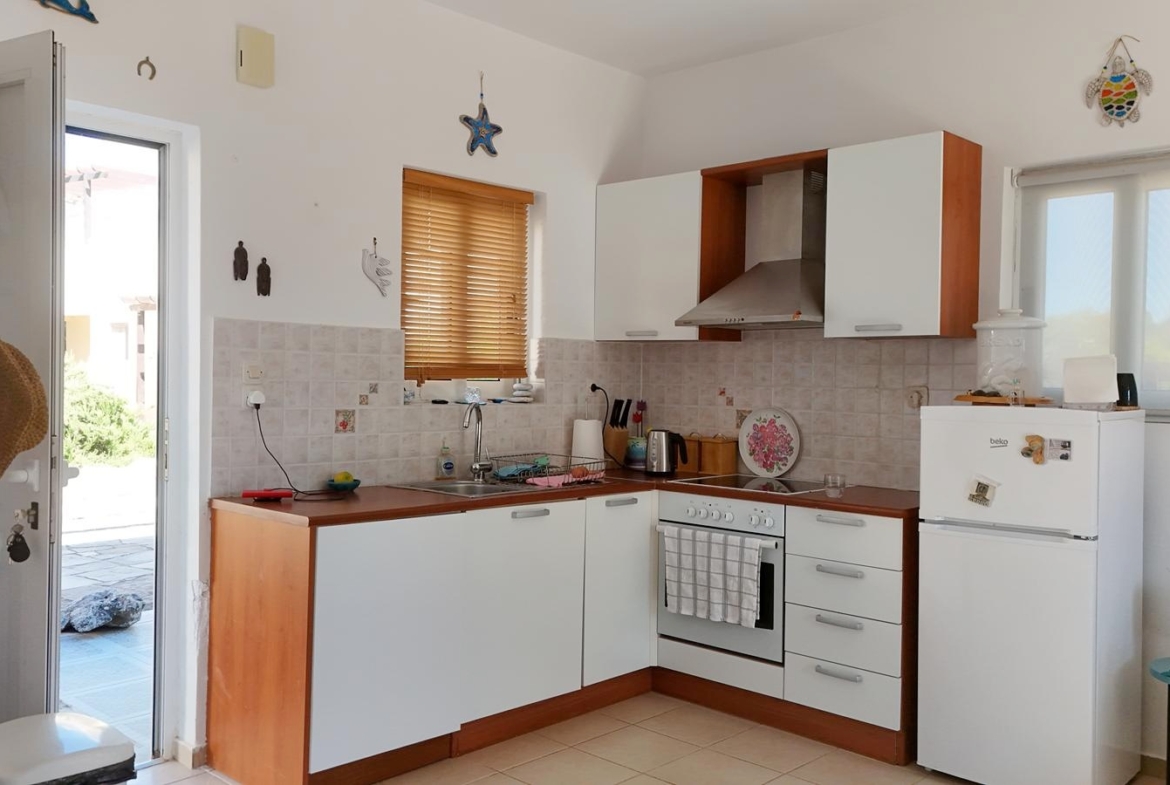 Two-bedroom house with a shared pool in Drapanos
