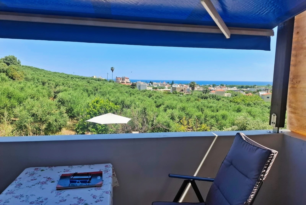 Second floor one-bedroom apartment with a sea view & shared pool in Tavronitis
