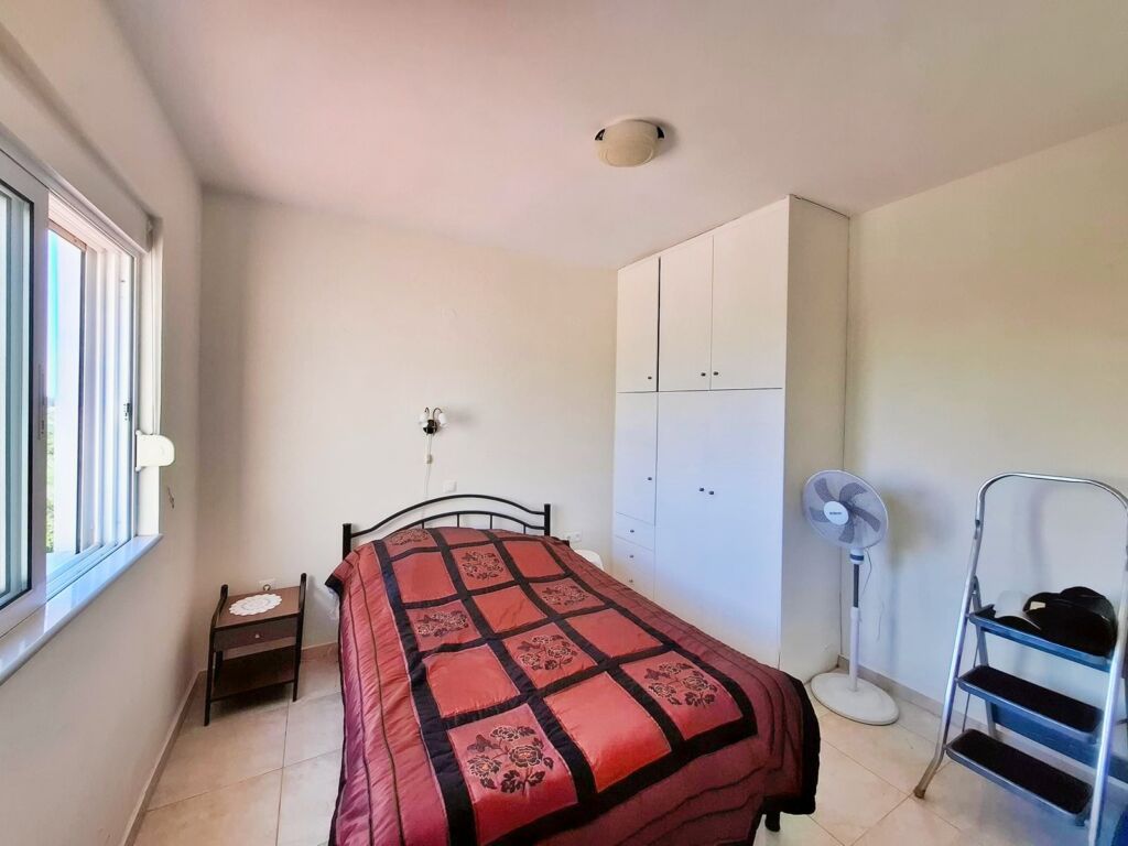 14 Second floor one-bedroom apartment with a sea view & shared pool in Tavronitis