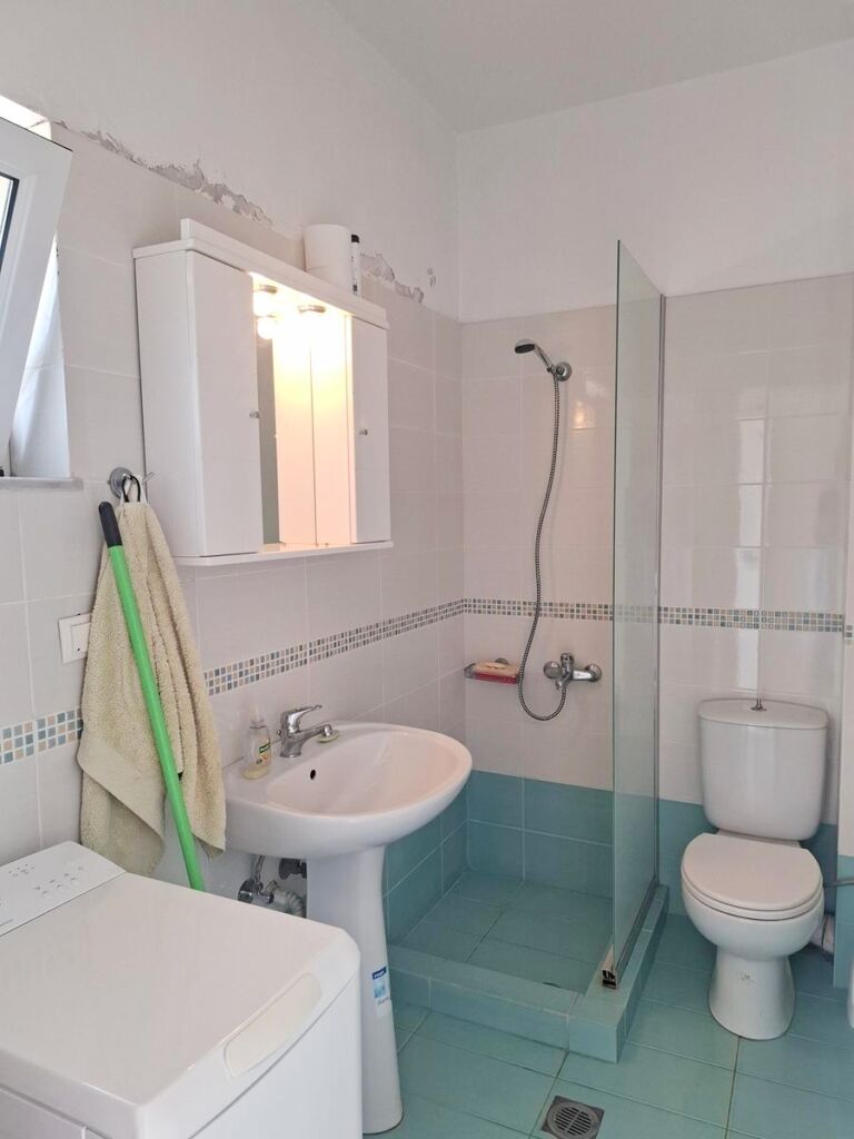 17 Second floor one-bedroom apartment with a sea view & shared pool in Tavronitis