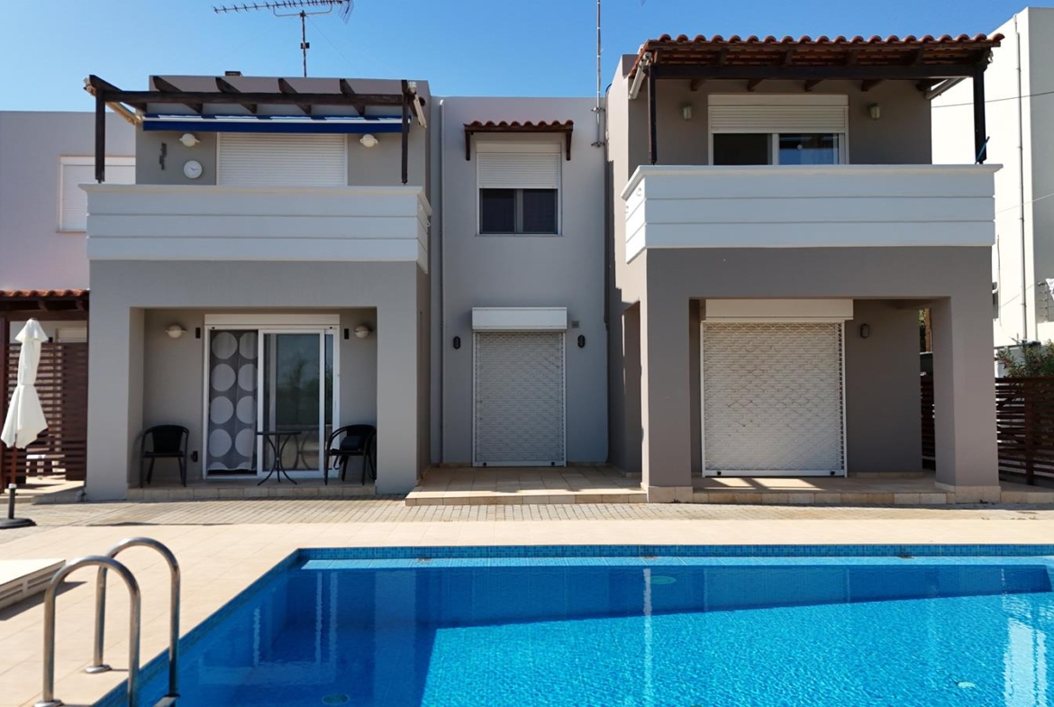 Second floor one-bedroom apartment with a sea view & shared pool in Tavronitis