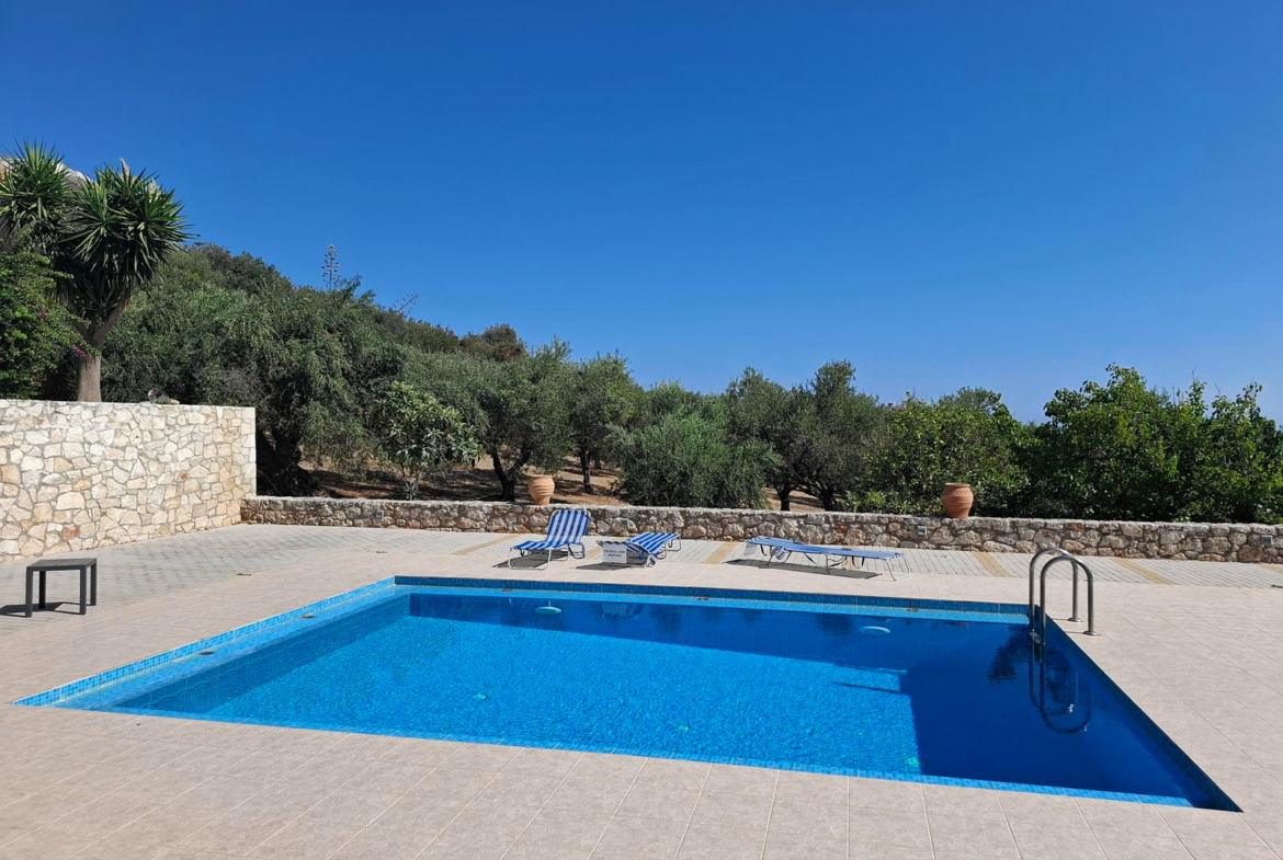 Second floor one-bedroom apartment with a sea view & shared pool in Tavronitis