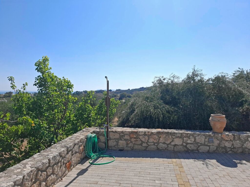 23 Second floor one-bedroom apartment with a sea view & shared pool in Tavronitis
