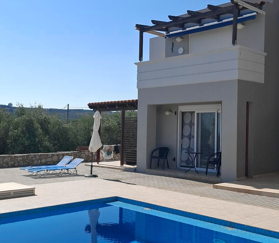 Second floor one-bedroom apartment with a sea view & shared pool in Tavronitis